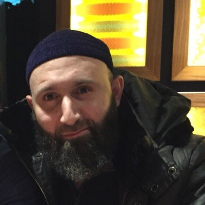 Про этого человека известно очень мало. Родился в 1979 году в селе Шалажи Урус-Мартановского района Чечни. В 2003 году упоминался в криминальной сводке: подозревался в том, что вместе с двумя подельниками у кинотеатра «Пушкинский» в Москве завладел чужим телефоном и сумкой с деньгами. Согласно утечке из одной из государственных баз данных, в 2013 году числился юристом в фирме, где директором была Елизавета Эльмурзаева.